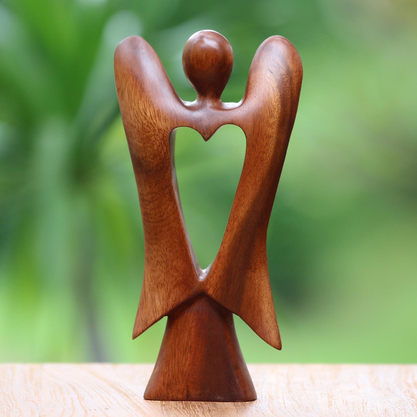 NOVICA Artisan Handmade Wood Figurine of Angel with Heart Feature Brown Indonesia Sculpture Christmas [9.75in H x 5in W x 1.8in D] 'Heart of an Angel'