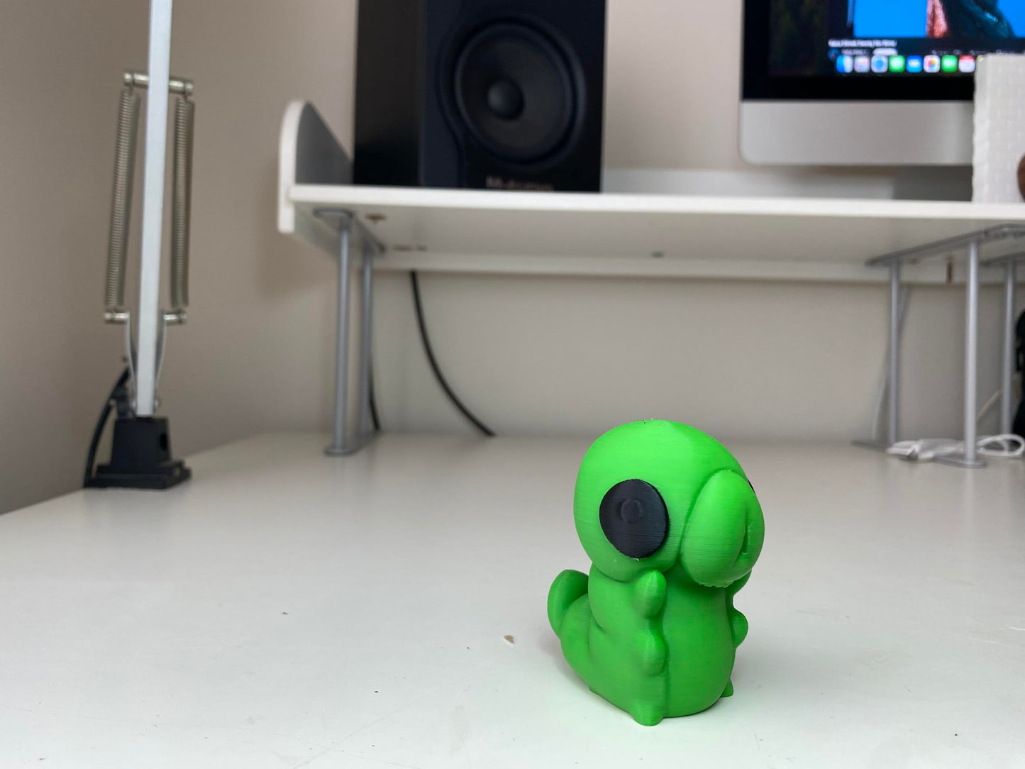 Little Green Grub Figurine - Vibrant Handheld Forest Creature Statue - Indie Game Inspired Desktop Companion and Gaming Room Shelf Decor