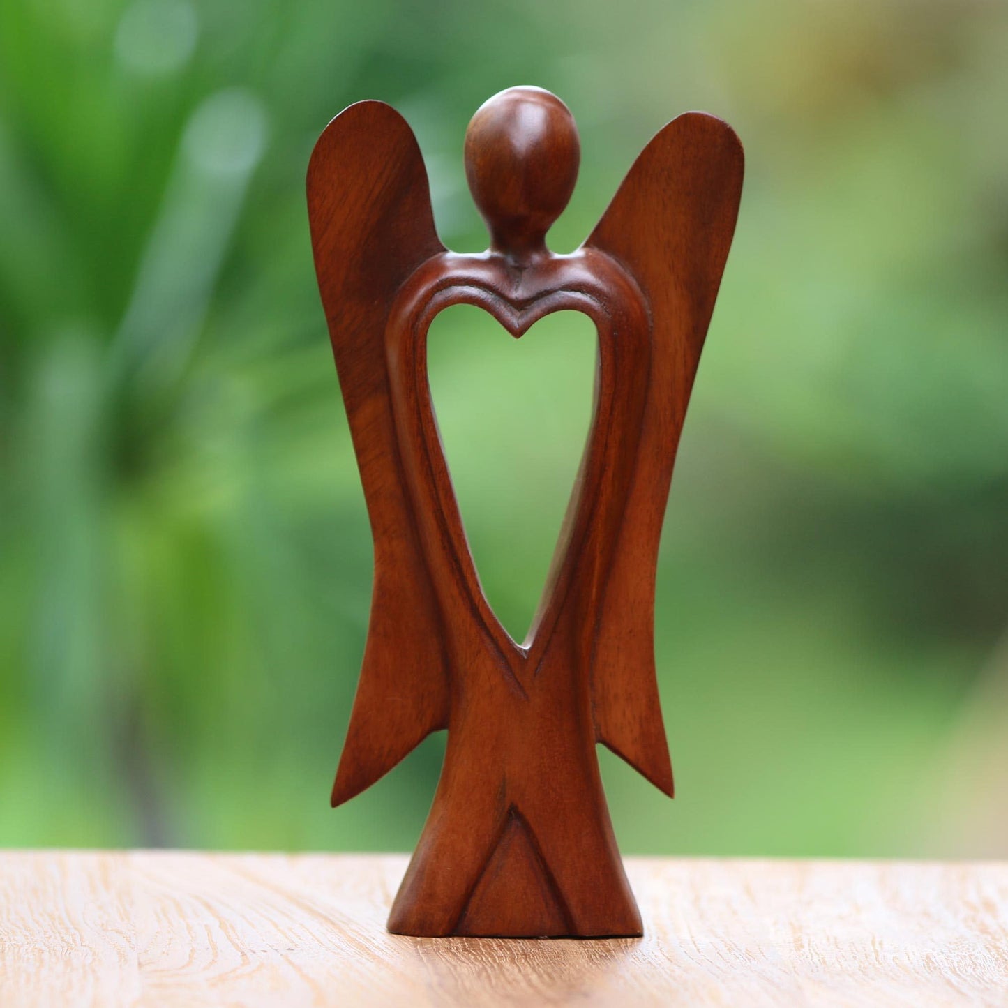 NOVICA Artisan Handmade Wood Figurine of Angel with Heart Feature Brown Indonesia Sculpture Christmas [9.75in H x 5in W x 1.8in D] 'Heart of an Angel'
