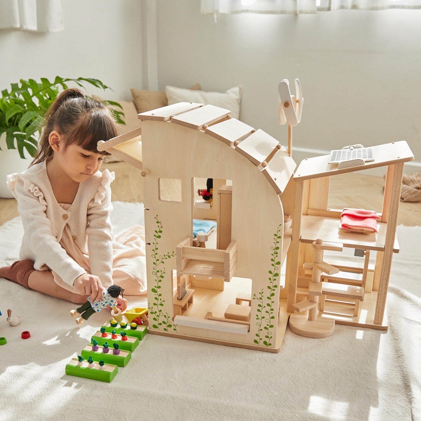 PlanToys® Green Wooden Dollhouse with Furniture | Eco Friendly Doll House with Solar Panel, Wind Turbine & Recycling System | Pretend Play Dollhouse for Sustainable Living Role Play